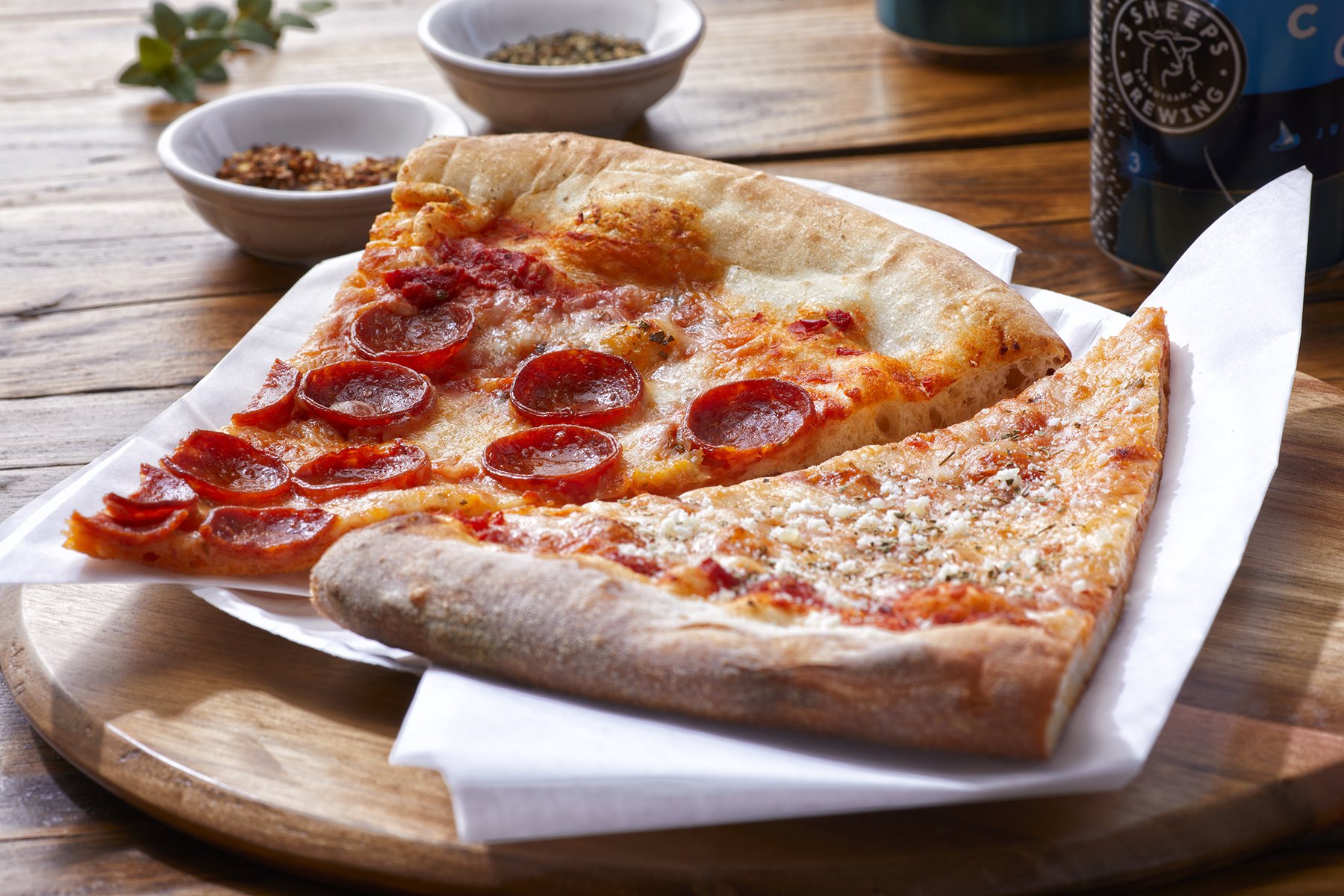 Pepperoni and cheese slices on a paper tray